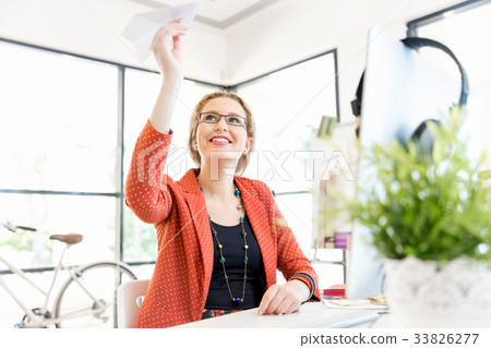 Young woman in office Young woman in office 33826277