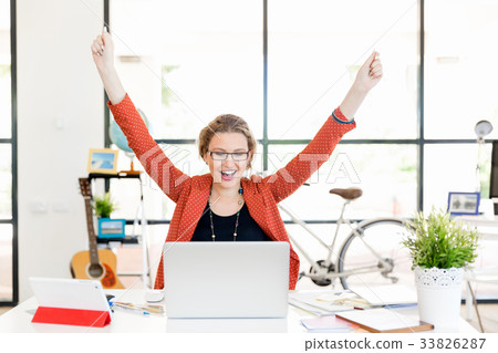 Young woman in office Young woman in office 33826287
