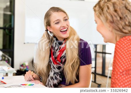 Two office workers at the desk Two office workers at the desk 33826942