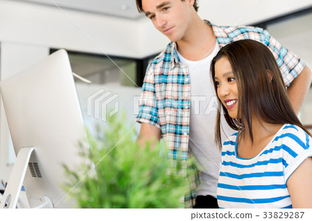 Two office workers at the desk 33829287