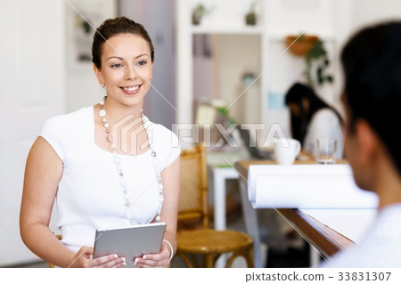 Successful young business executives meeting at the office Successful young business executives meeting at the office 33831307