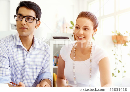 Two young people in office Two young people in office 33831418