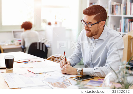 Young man in offfice 33832022