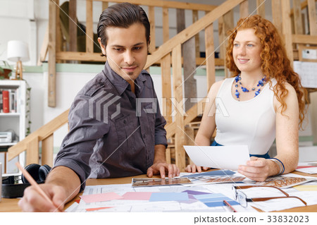 Two young architects in office 33832023