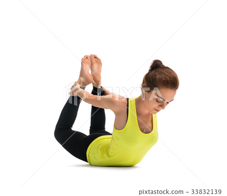 Pretty woman practising yoga isolated shot Pretty woman practising yoga isolated shot 33832139