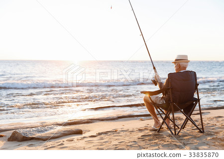 Senior man fishing at sea side Senior man fishing at sea side 33835870