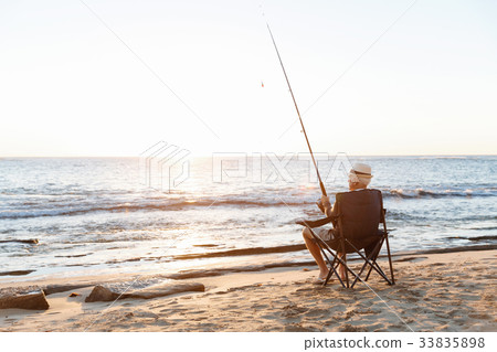 Senior man fishing at sea side 33835898