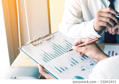 Business man pressing summary report chart  33841831