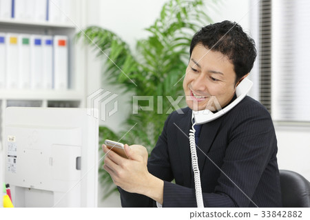 Middle businessman working in the office 33842882