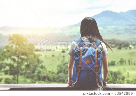 woman traveler looking at mountain view 33842899