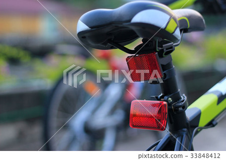 Back lights bicycle on street background 33848412