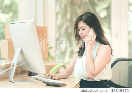 Young entrepreneur working on the smart computer Young entrepreneur working on the smart computer 33849573