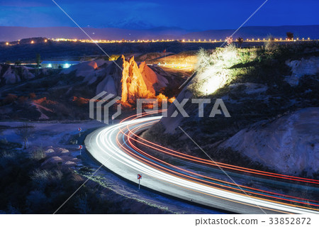 Night road in the mountains, the lights from the 33852872
