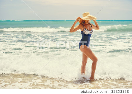 Woman on the beach Woman on the beach 33853528