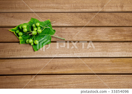 Turkey berry  on wooden table. 33854096