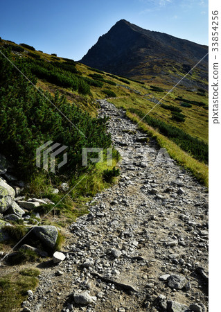 stone walkway towards the pointed peak stone walkway towards the pointed peak 33854256
