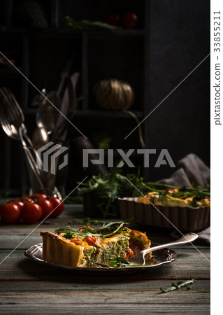Slice of delicious homemade quiche Slice of delicious homemade quiche 33855211