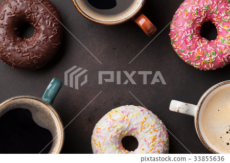 Coffee cups and colorful donuts 33855636