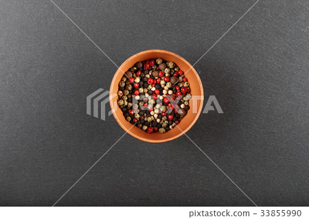 multi-colored pepper on a black background 33855990