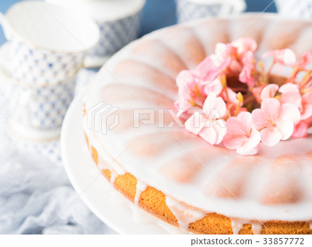 Bundt cake with frosting. Festive treat flowers Bundt cake with frosting. Festive treat flowers 33857772
