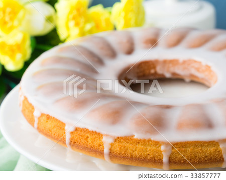 Bundt cake with frosting. Easter festive dessert Bundt cake with frosting. Easter festive dessert 33857777