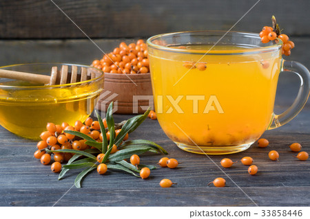 Tea of sea-buckthorn berries with honey and a 33858446
