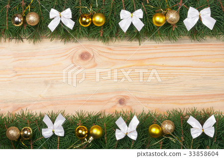 Christmas frame made of fir branches decorated Christmas frame made of fir branches decorated 33858604