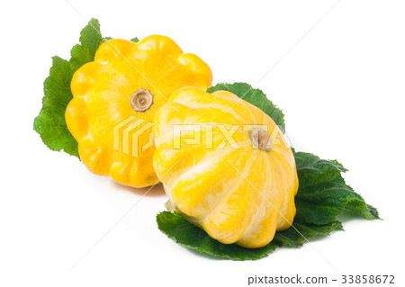 two yellow pattypan squash with leaf isolated on 33858672