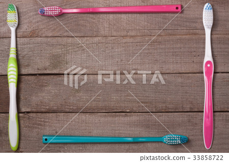 frame of manual toothbrushes on the old wooden frame of manual toothbrushes on the old wooden 33858722