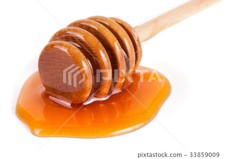 Honey stick with flowing honey isolated on white Honey stick with flowing honey isolated on white 33859009
