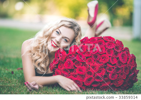 Elegant beautiful smiling woman is wearing black Elegant beautiful smiling woman is wearing black 33859314