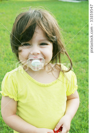 baby girl with pacifier 33859547