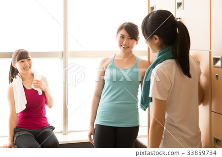 Woman relaxing in the changing room Woman relaxing in the changing room 33859734