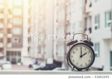2 o'clock retro clock with condominium background. 2 o'clock retro clock with condominium background. 33862045