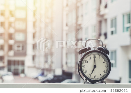 7 o'clock retro clock with condominium background. 7 o'clock retro clock with condominium background. 33862051