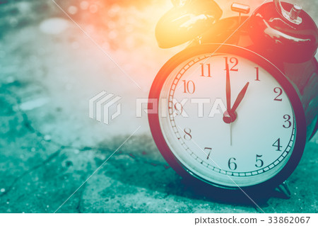 vintage clock selective focus at number 1 o'clock 33862067