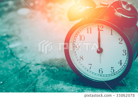 vintage clock selective focus at number 12 o'clock 33862078