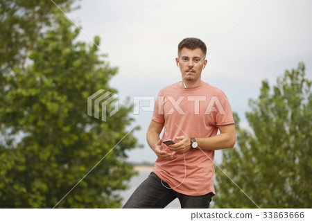 Guy listens to music Guy listens to music 33863666