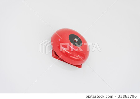 red fire alarm on white wall 33863790
