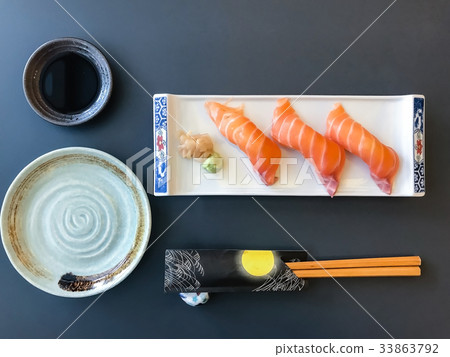 Set of salmon sushi and Sashimi on a white dish 33863792
