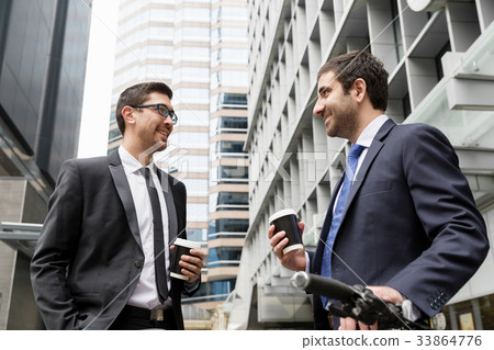Young businessmen with a bike Young businessmen with a bike 33864776