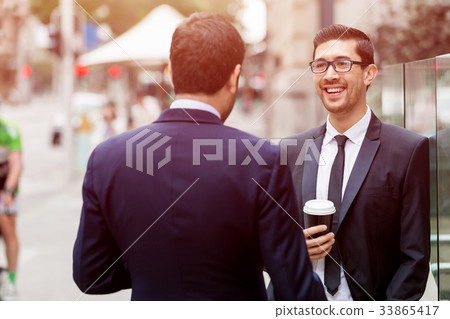 Two businessmen talking outdoors 33865417
