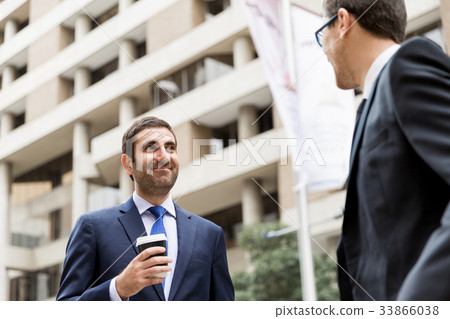 Two businessmen talking outdoors 33866038