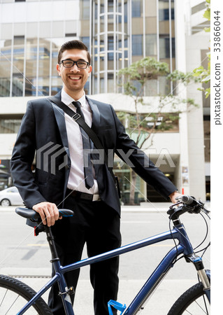 Young businessmen with a bike 33866044