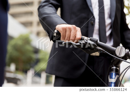 Young businessman with bike Young businessman with bike 33866124