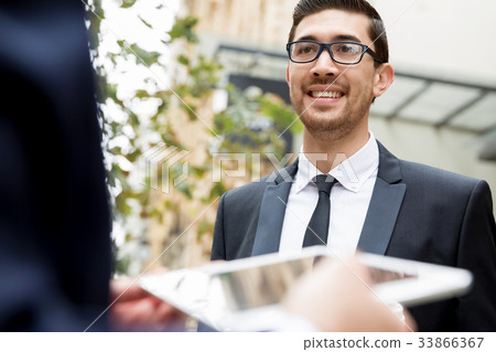 Portrait of handsome businessman outdoor 33866367