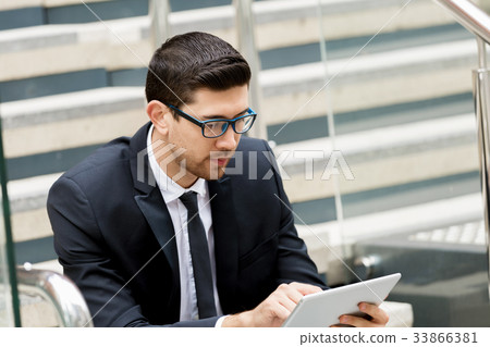 Portrait of handsome businessman outdoor 33866381