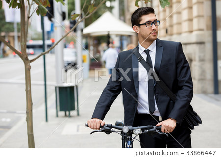 Young businessmen with a bike 33866447