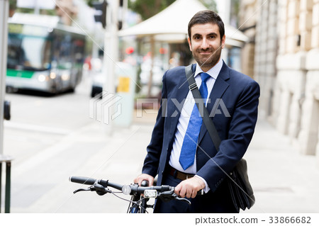 Young businessmen with a bike Young businessmen with a bike 33866682