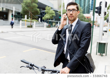 Young businessmen with a bike 33866748